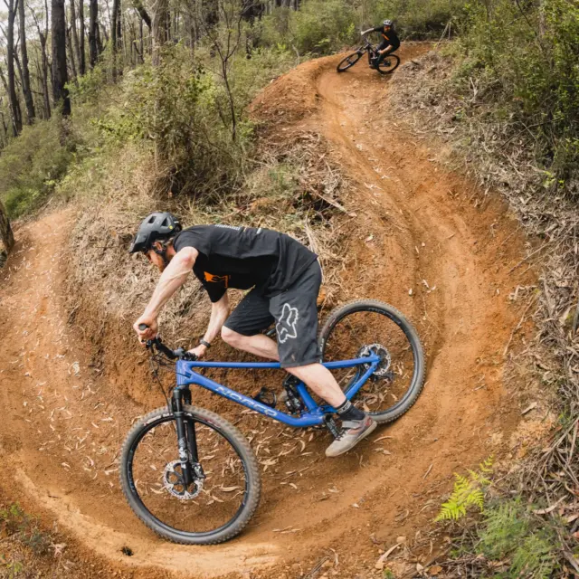 Mountain bike riding through the forest at Warburton Bike Park